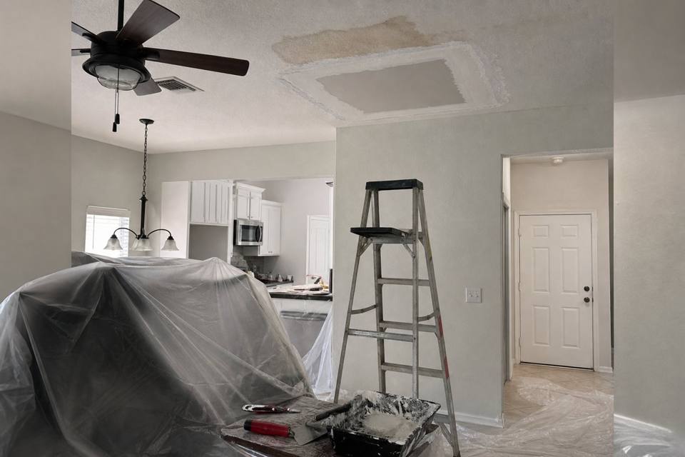 Ceiling drywall repair setup below a water stain for Orlando drywall projects