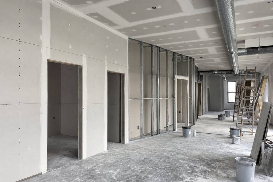Commercial drywall buildout with metal studs and sheetrock for Orlando drywall projects